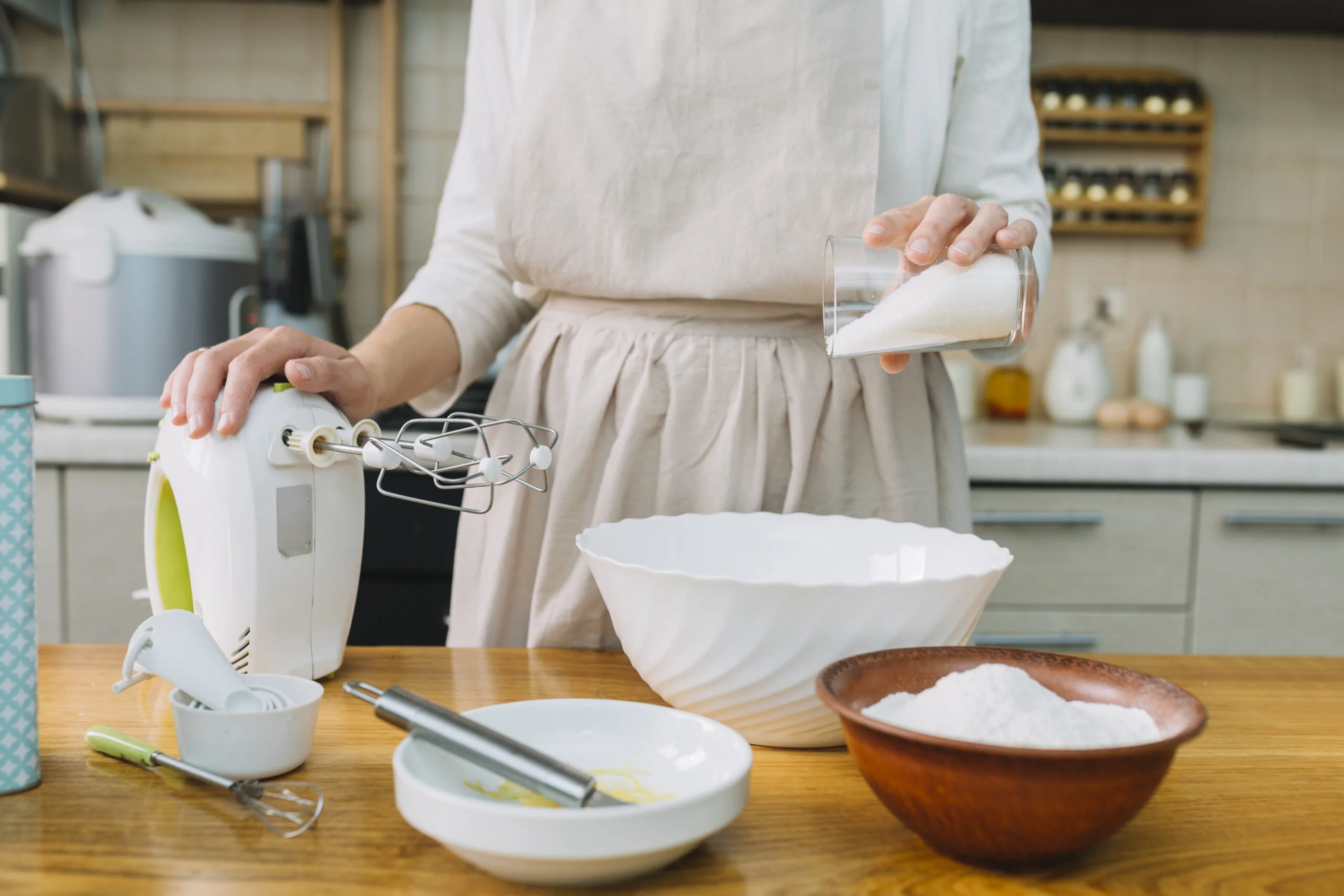 female-chef-preparing-pie-kitchen-with-ingredients-table | Azucake.com