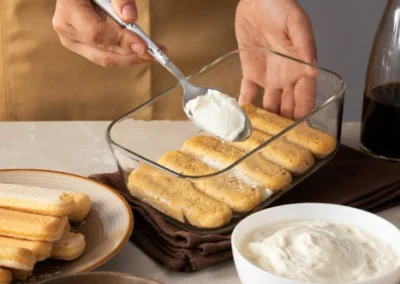high-angle-hands-cooking-delicious-tiramisu